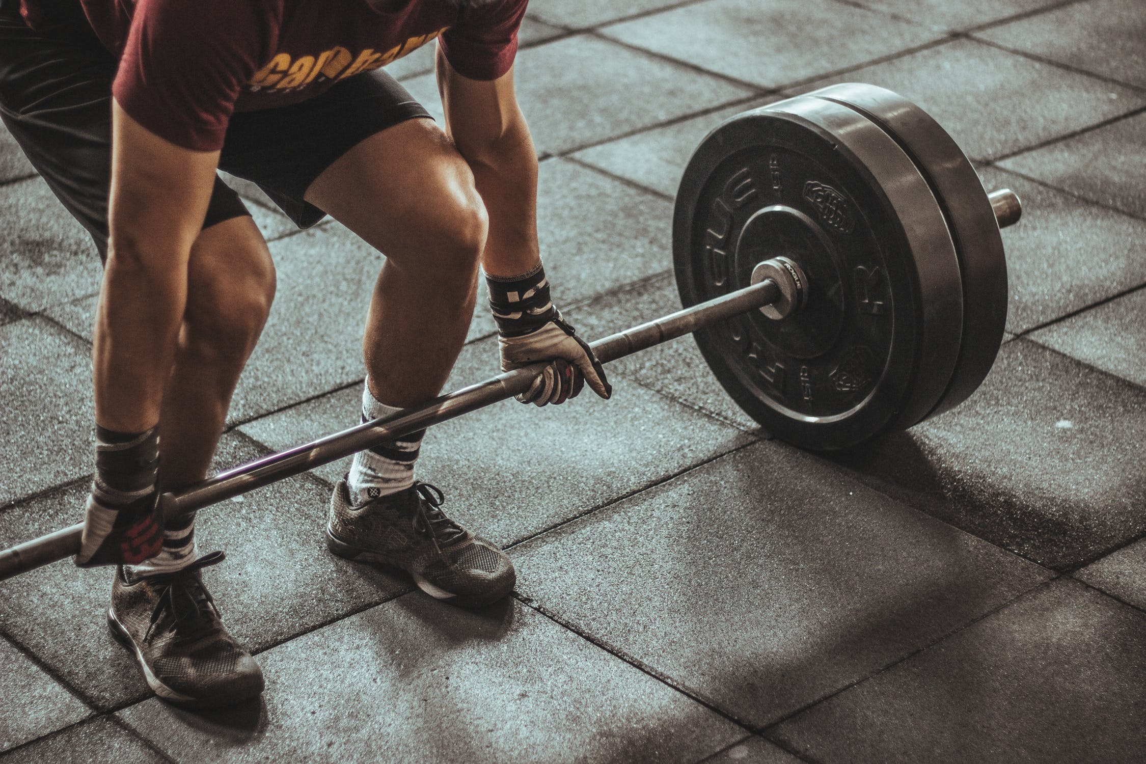 man lifting weights